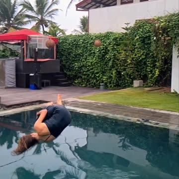 Flip into pool in a dress
