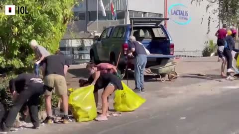 SOUTH AFRICA - Cleaning up the mess from looting in Durban North.