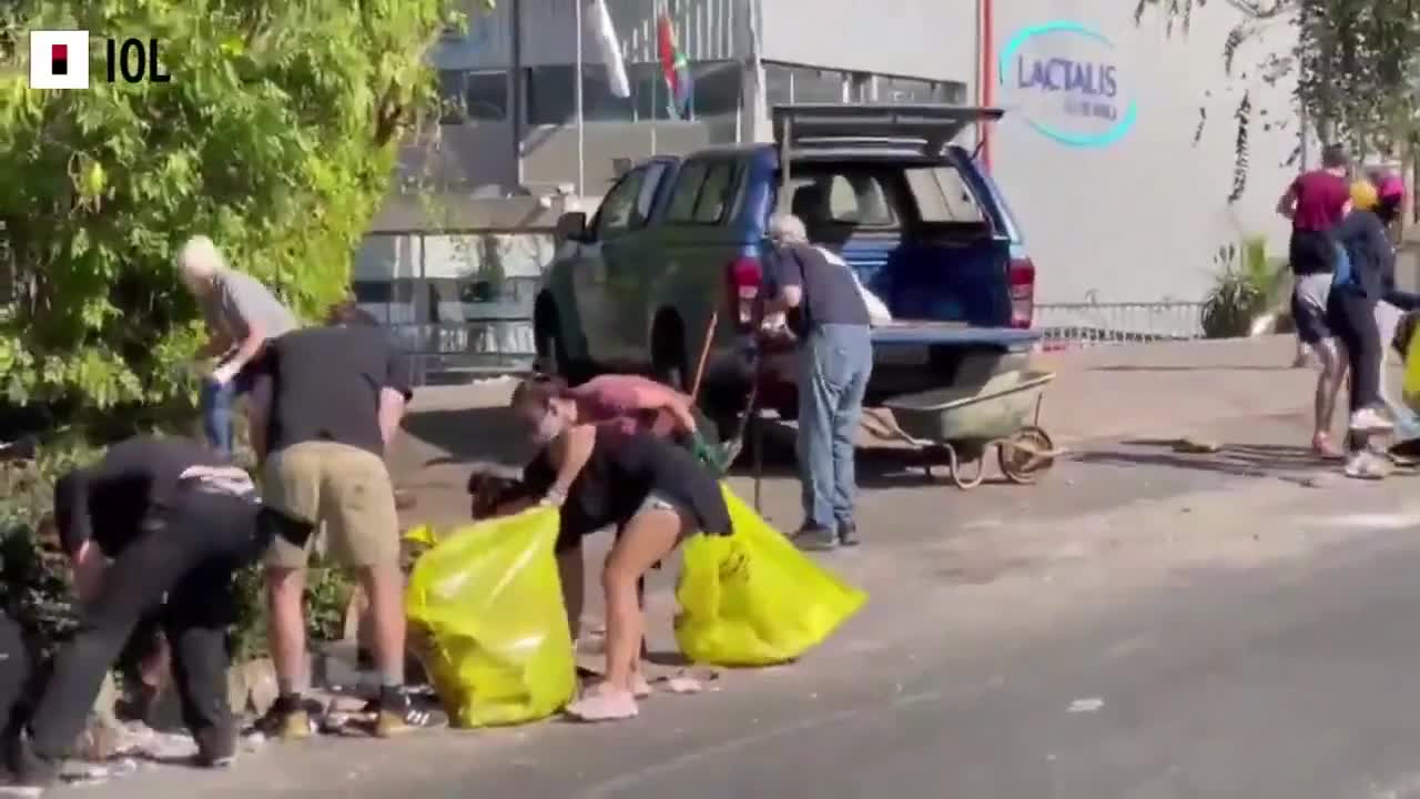 SOUTH AFRICA - Cleaning up the mess from looting in Durban North.