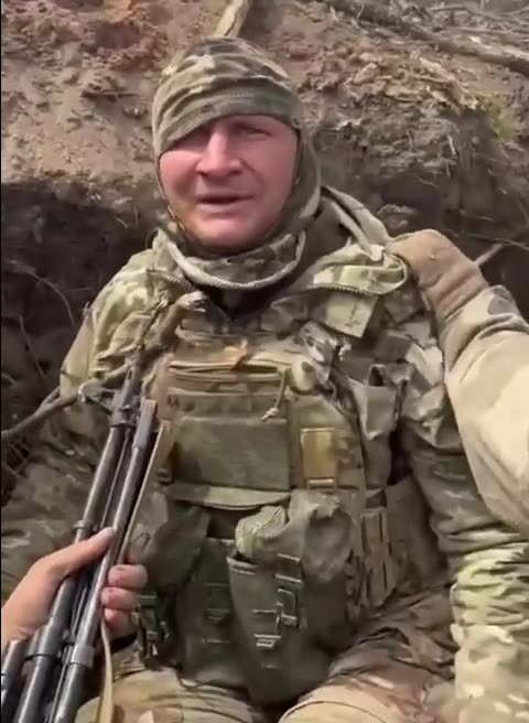 Ukrainians Disarming a Russian Soldier