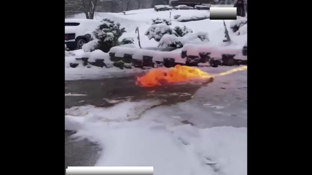 the fire man fights snow in front of his house