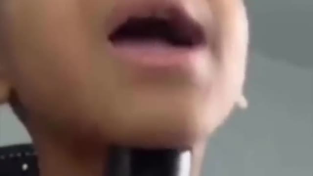 Kid uses grandmas voice box for auto tune