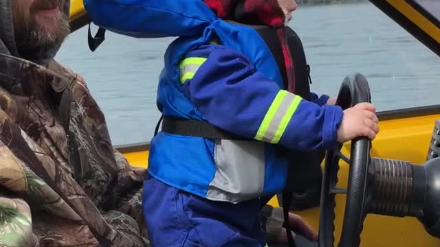 Tiny Tyke Enjoying First Boat Ride Of Spring