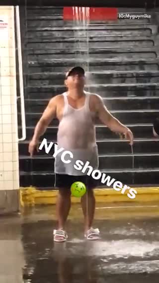 Nyc showers man stands under water falling in subway