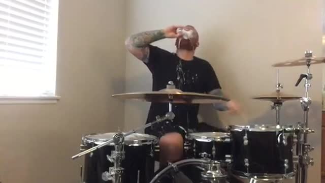 Drummer opens beer with drumstick and drinks after drum solo
