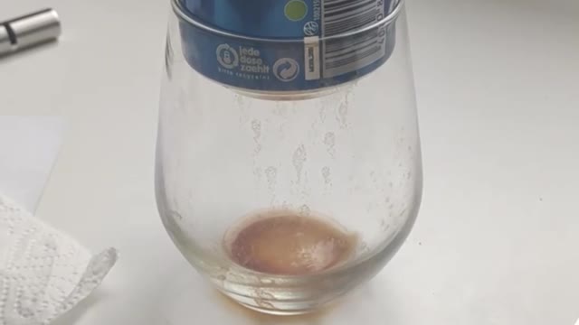 Satisfying video of Can fitting perfectly in a glass