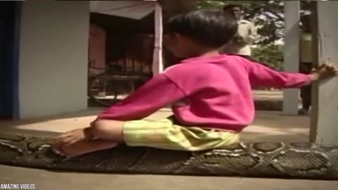 6 years old combodian kid has 16 feet python