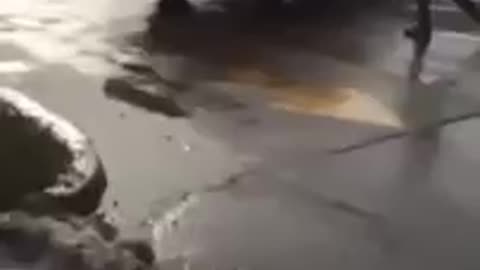 Running truck slips into gear while man is in the store