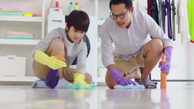 Son and Dad cleaning the floor.