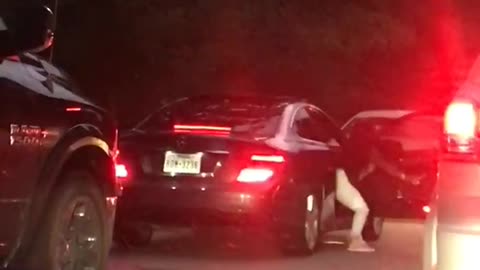 Girl dances during traffic