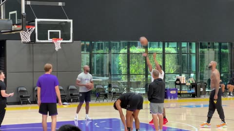 LeBron James, Bronny James and Max Christie shooting free throws