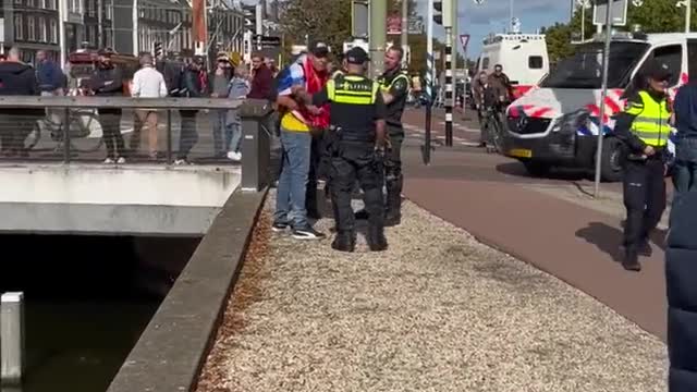 Hague, Netherlands: Police arrest protester, tow tractor (Sept. 20, 2022)
