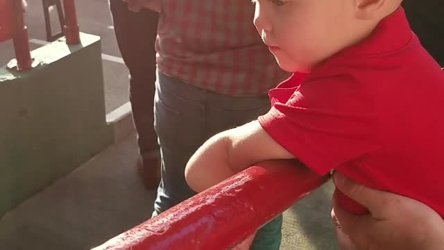 1 year old high fives fans coming into red sox stadium.