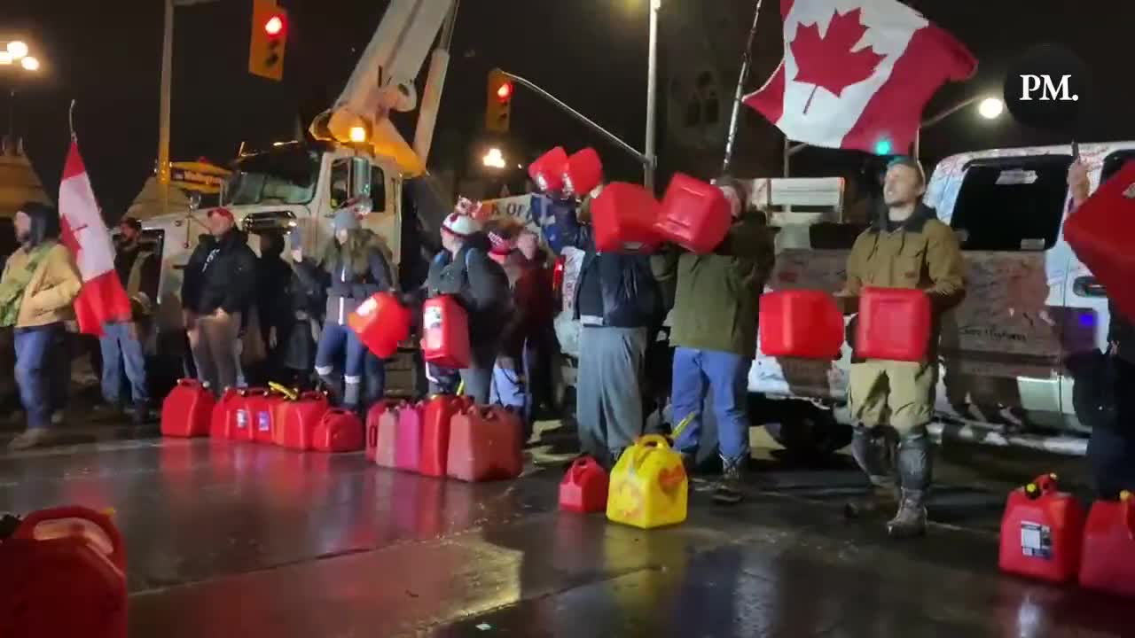 Freedom Convoy truckers and supporters make music together by revving engines and banging jerrycans.