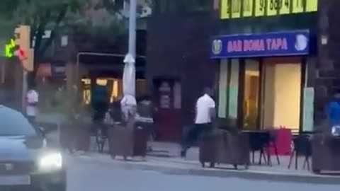 Moroccan walks through the streets of Barcelona carrying the gun