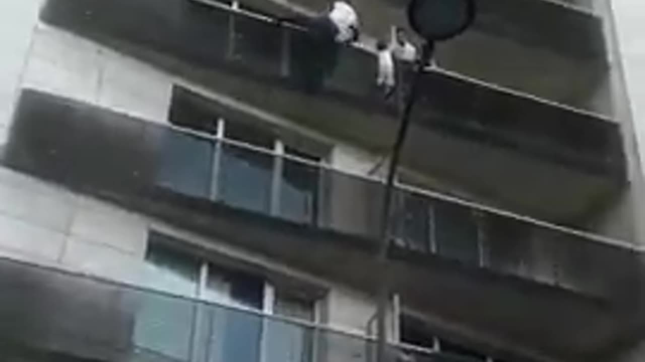 Man scales a building in Paris to save a child dangling from a 5th-floor balcony