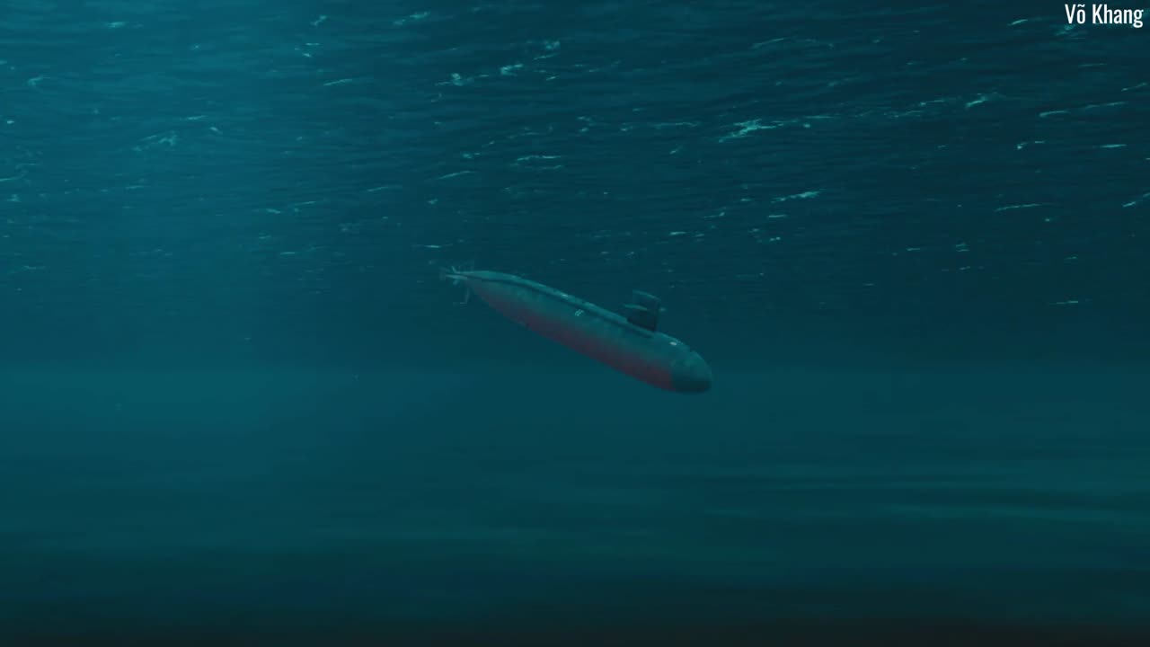 The US Navy attack submarine USS Narwhal (SSN-671) surfaces and dives below the sea surface.