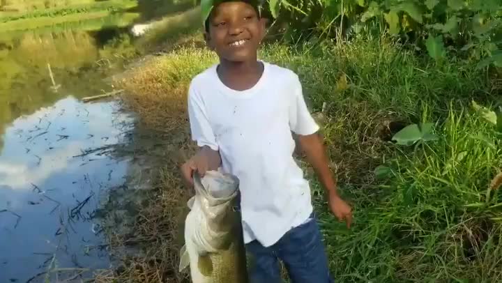 This little guy catches a huge fish then does the unexpected.👏👏👏