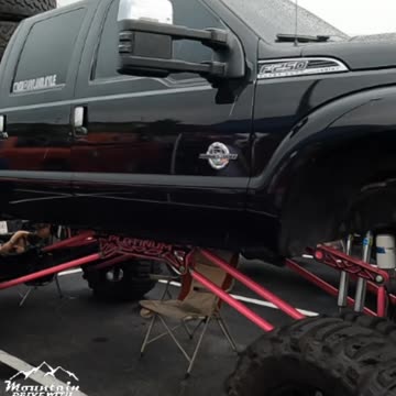 Lifted Ford F250 4X4 Pickup Truck Platinum Pink and Black