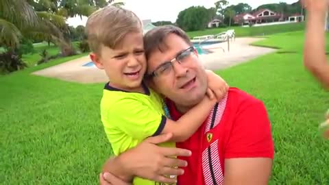 Two children learn how to play outdoor games