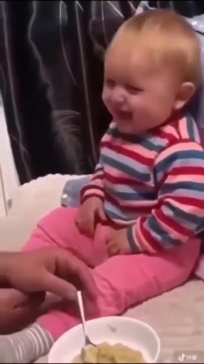 Doberman playing with Baby