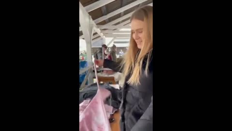Smiling Ukrainians make hundreds of Molotov cocktails to greet Russians. Amazing.