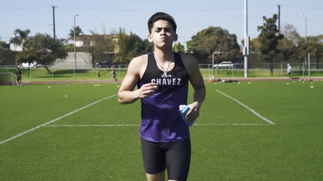 A Man Drinking while Running