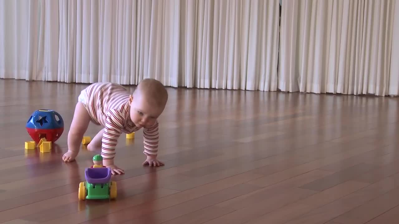 beautiful baby learning to crawl