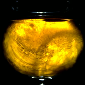 Super Chilled Whiskey Poured Into Glass Temperature Blends for Light Show