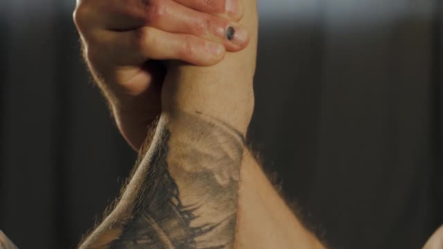 Close-Up View of People Doing an Arm Wrestling Match