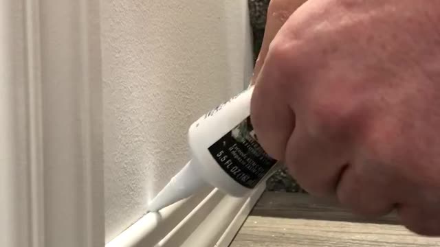 Caulking baseboard tip