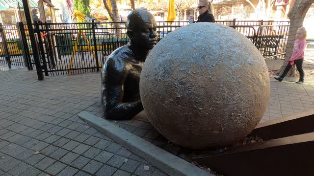 Strange Art ~ Man Rolling Ball