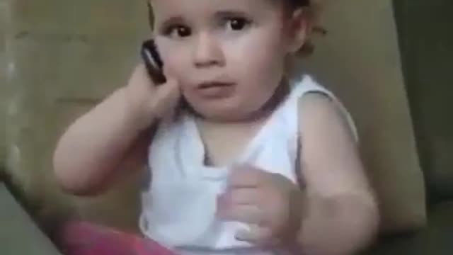 cute little kid using phonecall