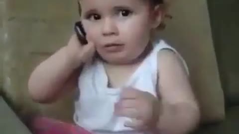 cute little kid using phonecall