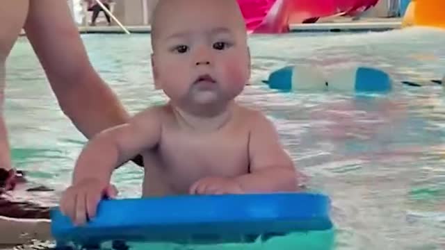 Baby learning to swim