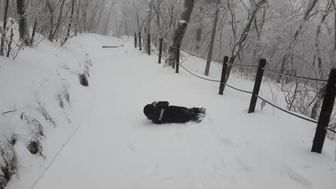 Rolling down a snowy mountain