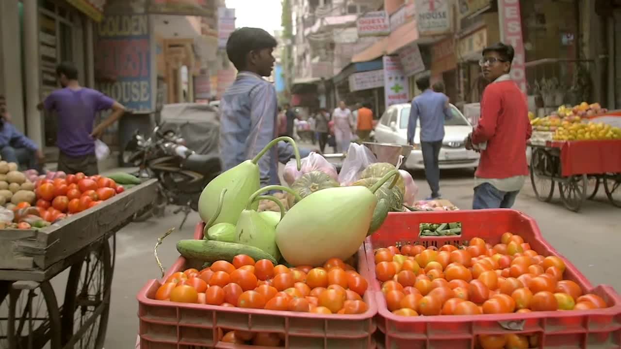 Slow Motion Shot of a Boy Pulling a Fruit Cart