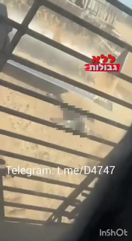 Zionist IDF: Occupation army bulldozers trample the body of a Palestinian civilian.