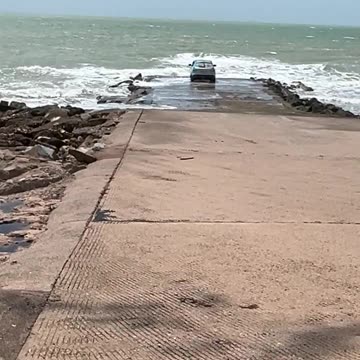 That will not end well, car on a boat ramp.