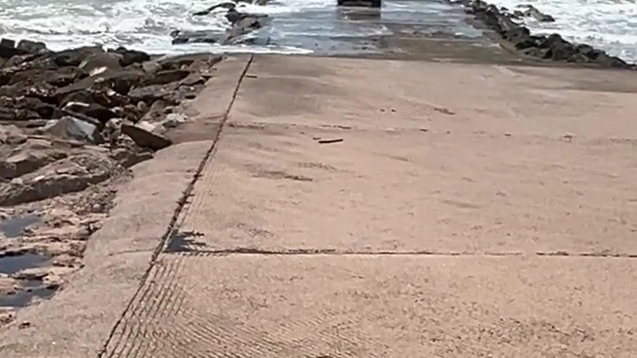 That will not end well, car on a boat ramp.