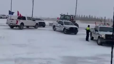 Canadian farmers break through police barricades to support Truckers