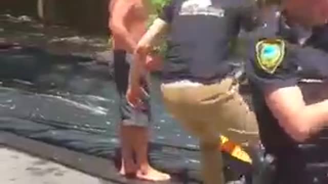 Police Officer Rides Slip and Slide with Kids