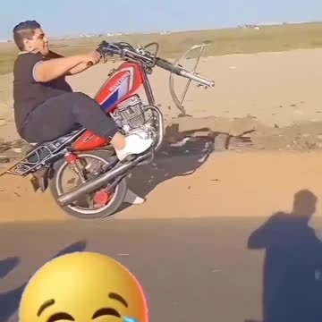 Riding a motorcycle without a front wheel on the rack and falling