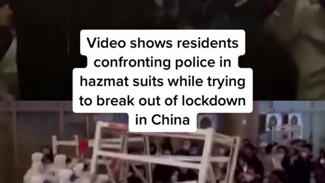 Video shows residents confronting police in hazmat suits while trying to break out of lockdown