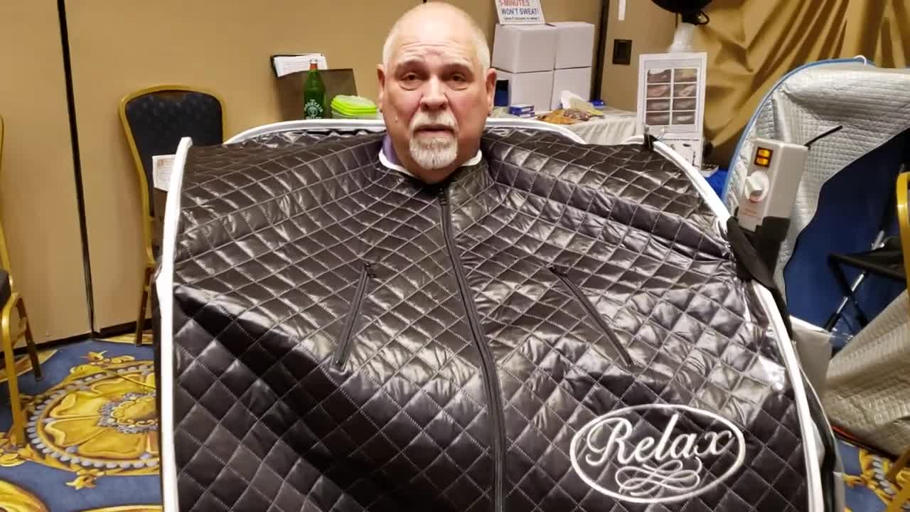 Man experiences pain relief using infrared sauna