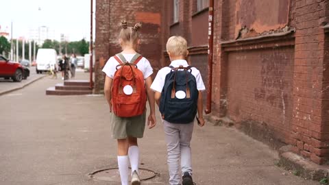 Brother and Sister Walking to School