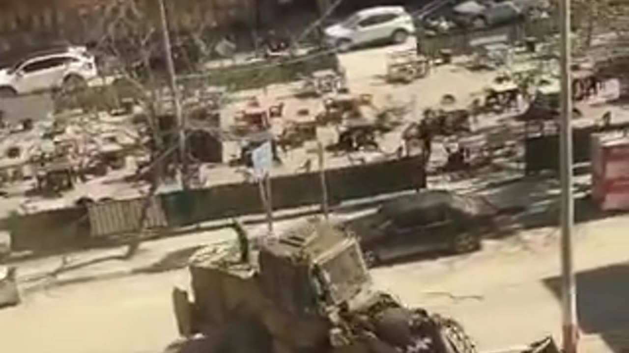 Israeli armored vehicles chasing Palestinian car