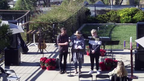 Kauffman family lighting Advent candle of Love