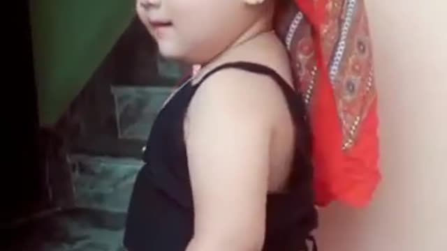 Cute Nepalese baby girl dancing in Nepali song.