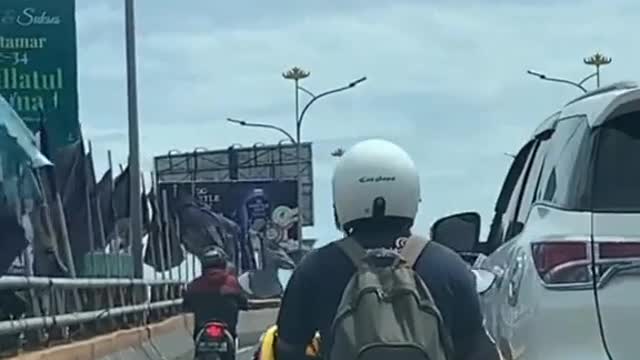 angry couple on motorbike until jatuh